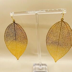 Larger gold color filigree leaf earrings. Drop Dangle. Bohemian. Ethnic.